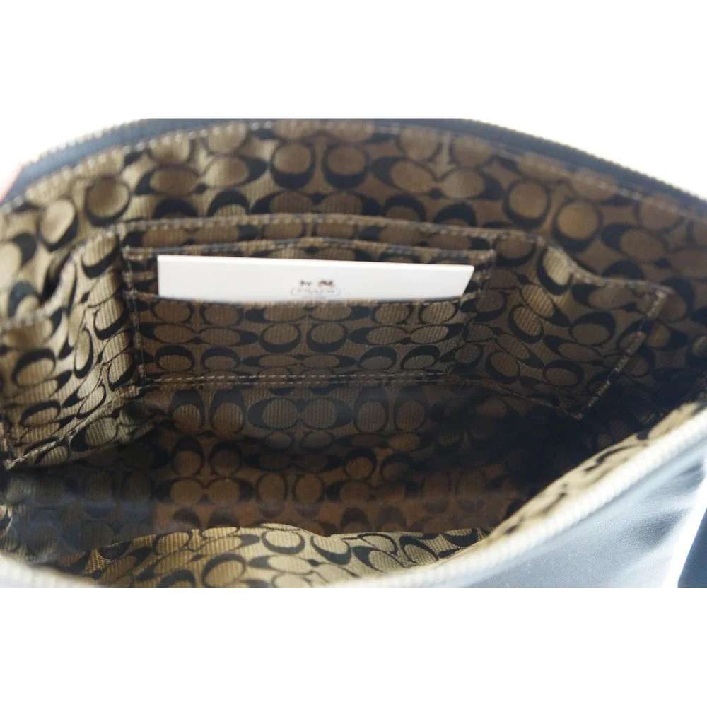 Coach Wristlet Black Leather Silver Hardware Logo Plaque Excellent